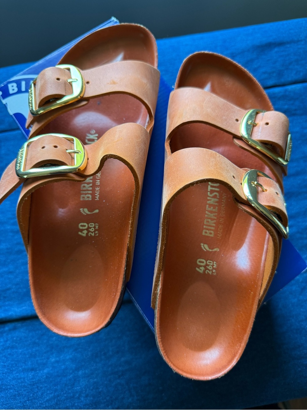 Orange Birkenstock Arizona Sandals with Gold Buckles
